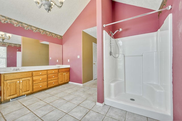 784 S 17th St, Ozark, MO 65721 - full bath with a chandelier, lofted ceiling, tile patterned flooring, double vanity, and a textured ceiling