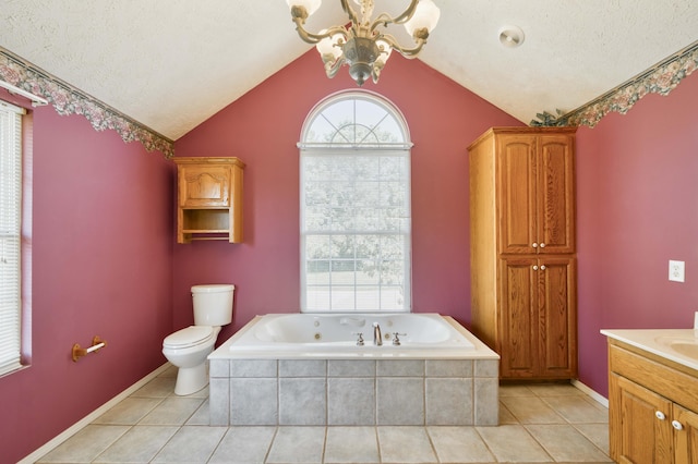 784 S 17th St, Ozark, MO 65721 - bathroom with a jetted tub, vaulted ceiling, vanity, tile patterned floors, and a chandelier