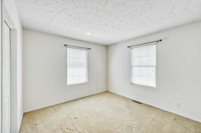 784 S 17th St, Ozark, MO 65721 - unfurnished room featuring carpet flooring and a textured ceiling