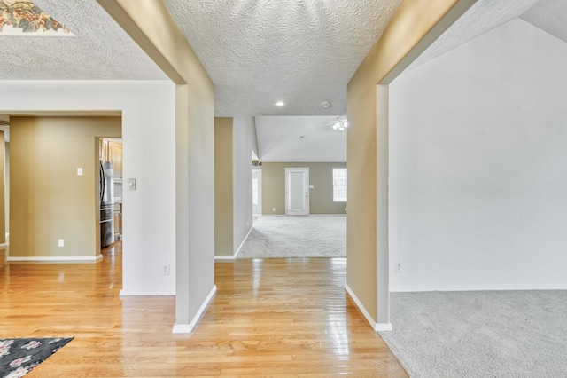 784 S 17th St, Ozark, MO 65721 - hall with light wood finished floors, a textured ceiling, and recessed lighting