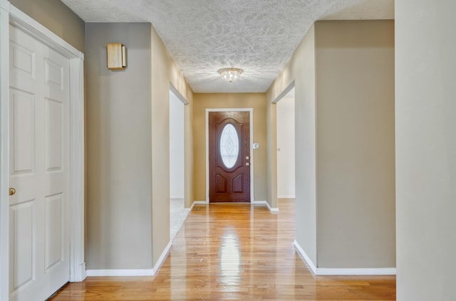784 S 17th St, Ozark, MO 65721 - entryway featuring a textured ceiling and light wood-style flooring