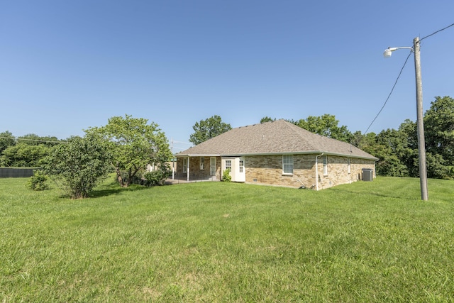 784 S 17th St, Ozark, MO 65721 - back of property with a lawn, brick siding, and roof with shingles