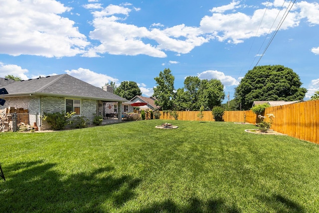 715 W Wasson St, Nixa, MO 65714 - fenced backyard with an outdoor fire pit