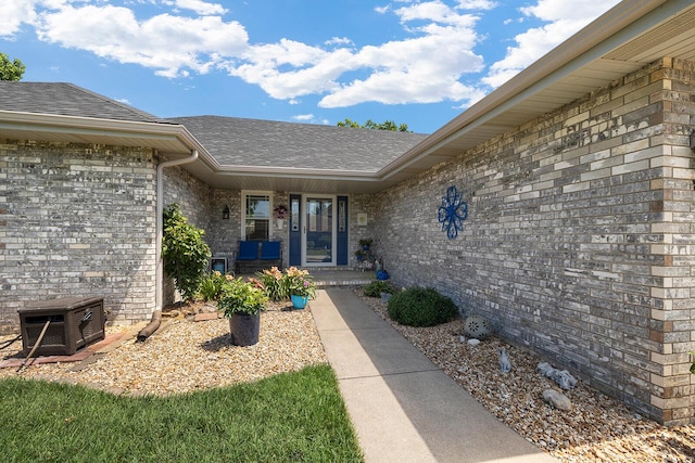 715 W Wasson St, Nixa, MO 65714 - entrance to property featuring roof with shingles and brick siding