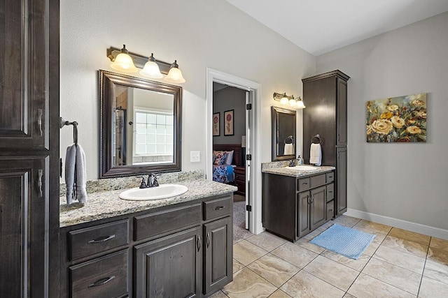2741 Summit Dr, Joplin, MO 64804 - bathroom with two vanities, ensuite bath, and tile patterned flooring
