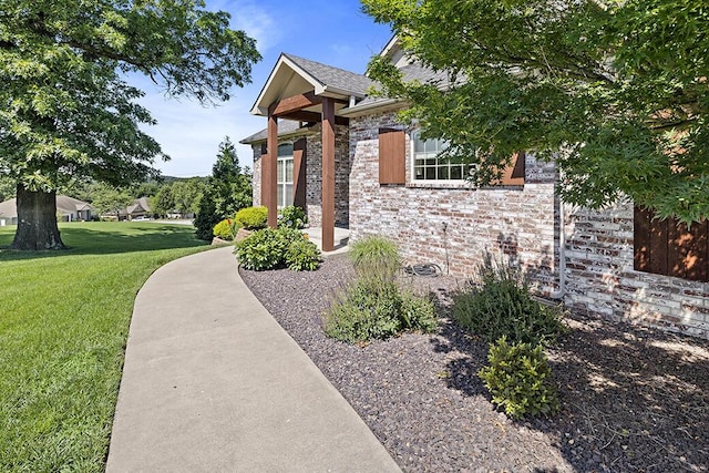 2741 Summit Dr, Joplin, MO 64804 - exterior space featuring a front lawn and brick siding