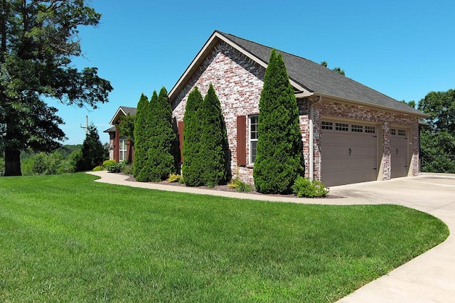 2741 Summit Dr, Joplin, MO 64804 - view of side of property featuring concrete driveway, a yard, an attached garage, brick siding, and a shingled roof