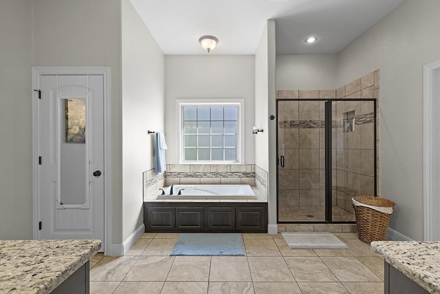 2741 Summit Dr, Joplin, MO 64804 - full bath featuring a garden tub, a shower stall, and tile patterned floors