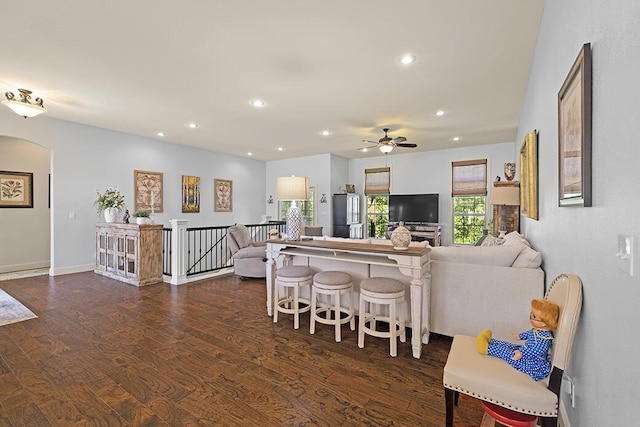 2741 Summit Dr, Joplin, MO 64804 - living area featuring dark wood-style flooring, arched walkways, recessed lighting, and a ceiling fan