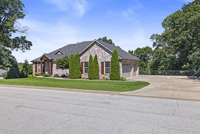 2741 Summit Dr, Joplin, MO 64804 - craftsman house featuring stone siding, driveway, and a garage