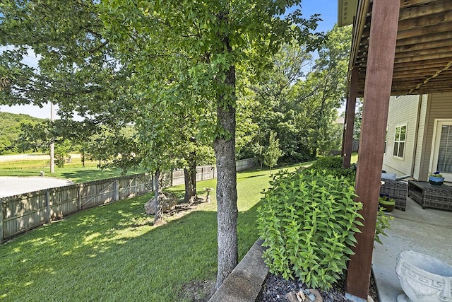 2741 Summit Dr, Joplin, MO 64804 - fenced backyard with a patio area