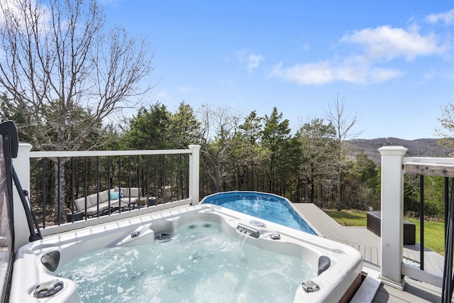 859 Crows Nest Trl, Branson, MO 65616 - view of swimming pool with a wooden deck and a hot tub