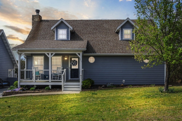 859 Crows Nest Trl, Branson, MO 65616 - view of front of property with a porch, a front lawn, a chimney, and a shingled roof