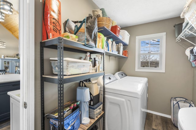 859 Crows Nest Trl, Branson, MO 65616 - washroom with washer and clothes dryer and dark wood-type flooring