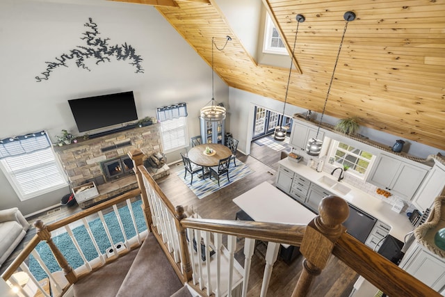 859 Crows Nest Trl, Branson, MO 65616 - living area with high vaulted ceiling, a fireplace, wood ceiling, and wood finished floors
