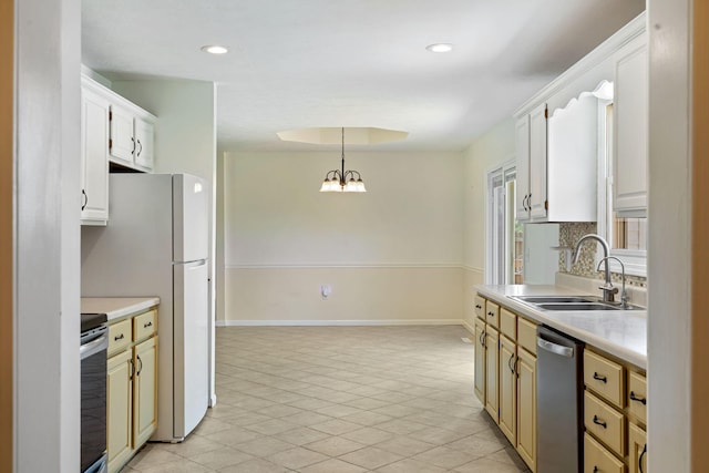 1035 Scenic View Rd, Ozark, MO 65721 - kitchen with appliances with stainless steel finishes, light countertops, pendant lighting, recessed lighting, and a chandelier