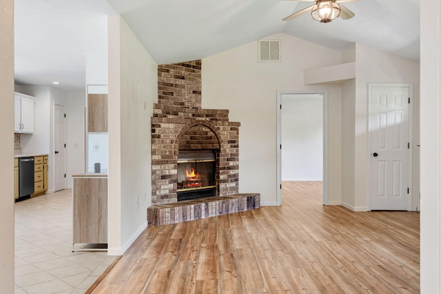 1035 Scenic View Rd, Ozark, MO 65721 - unfurnished living room with ceiling fan, light wood-type flooring, a brick fireplace, and lofted ceiling