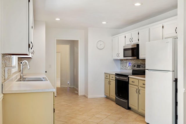 1035 Scenic View Rd, Ozark, MO 65721 - kitchen featuring stainless steel appliances, decorative backsplash, light countertops, recessed lighting, and white cabinetry