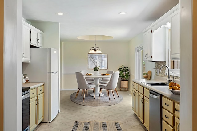 1035 Scenic View Rd, Ozark, MO 65721 - kitchen featuring stainless steel appliances, decorative light fixtures, light countertops, recessed lighting, and light tile patterned flooring