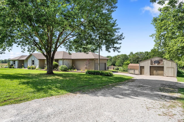 1035 Scenic View Rd, Ozark, MO 65721 - view of front of house featuring a front yard, a detached garage, driveway, and an outdoor structure