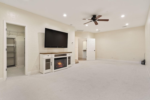 1035 Scenic View Rd, Ozark, MO 65721 - unfurnished living room featuring ceiling fan, recessed lighting, carpet flooring, and a glass covered fireplace