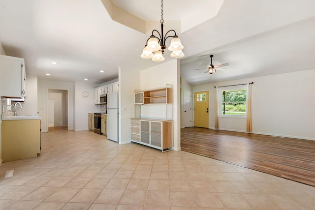 1035 Scenic View Rd, Ozark, MO 65721 - kitchen featuring stainless steel appliances, ceiling fan, a chandelier, light countertops, and white cabinetry
