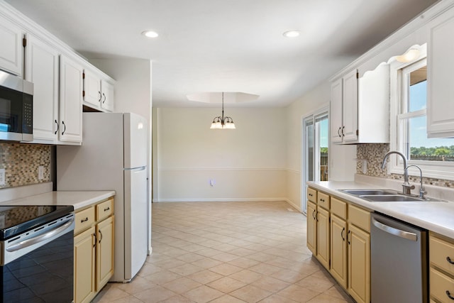 1035 Scenic View Rd, Ozark, MO 65721 - kitchen featuring appliances with stainless steel finishes, backsplash, light countertops, healthy amount of natural light, and recessed lighting