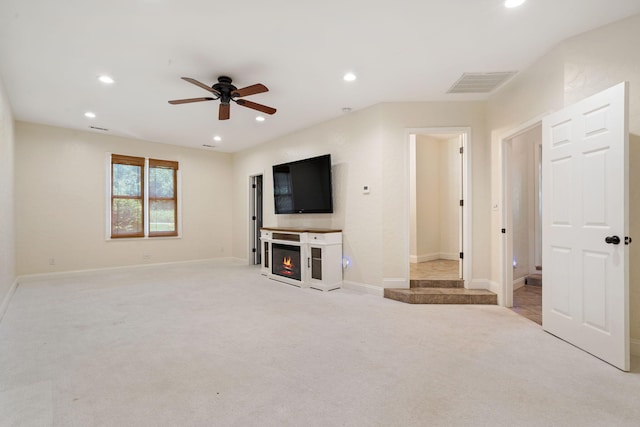 1035 Scenic View Rd, Ozark, MO 65721 - unfurnished living room with a ceiling fan, a lit fireplace, recessed lighting, and light colored carpet