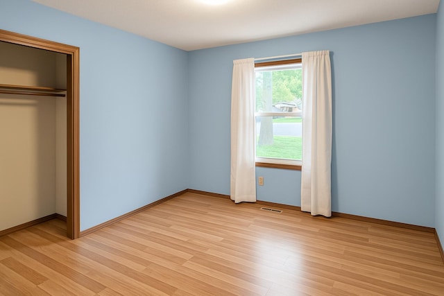 114 S Pinewood Ave, Republic, MO 65738 - unfurnished bedroom featuring light wood-style flooring and a closet