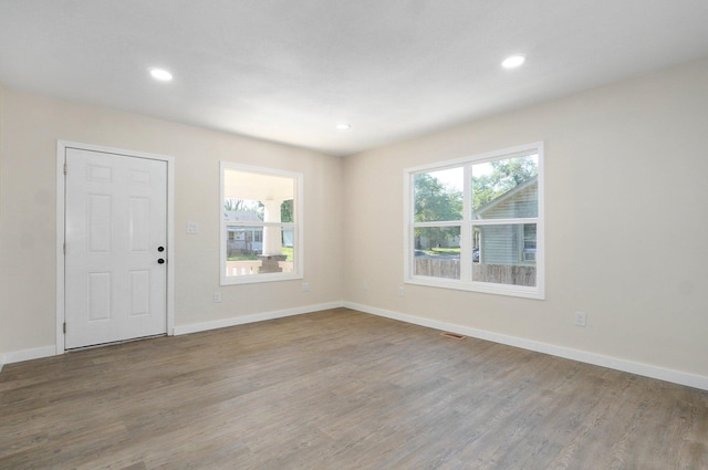 2131 N Pickwick Ave, Springfield, MO 65803 - empty room with wood finished floors, plenty of natural light, and recessed lighting