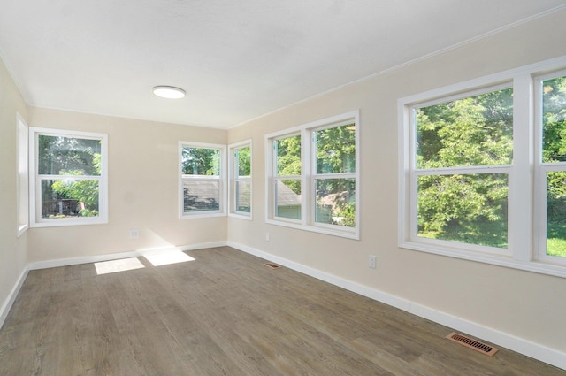 2131 N Pickwick Ave, Springfield, MO 65803 - unfurnished sunroom featuring plenty of natural light and wood finished floors