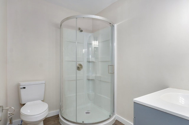 2131 N Pickwick Ave, Springfield, MO 65803 - bathroom featuring a shower stall, vanity, and wood finished floors