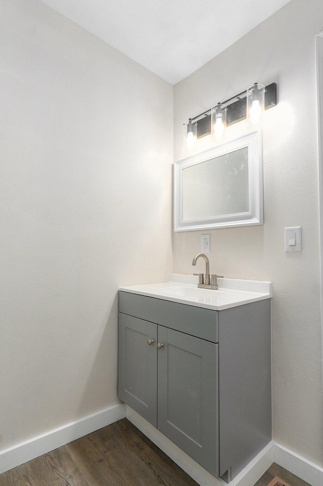 2131 N Pickwick Ave, Springfield, MO 65803 - bathroom featuring wood finished floors and vanity
