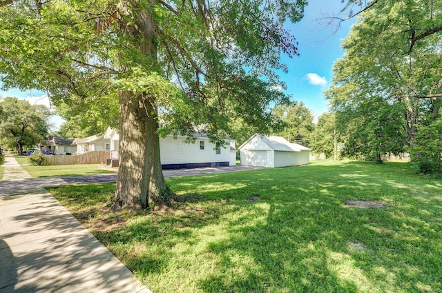 2131 N Pickwick Ave, Springfield, MO 65803 - view of yard with a detached garage and an outbuilding