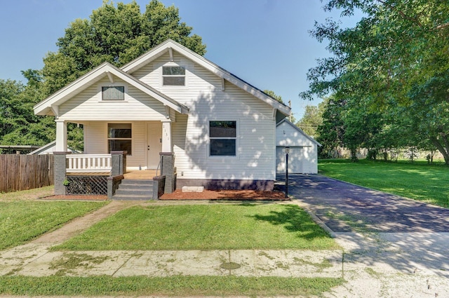 2131 N Pickwick Ave, Springfield, MO 65803 - view of front facade featuring covered porch, asphalt driveway, and an outbuilding