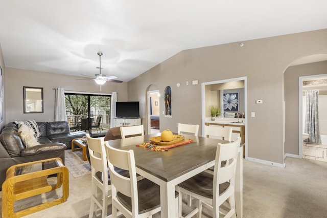 350 Wildwood Dr S Unit 31, Branson, MO 65616 - dining space with arched walkways, light colored carpet, ceiling fan, and vaulted ceiling