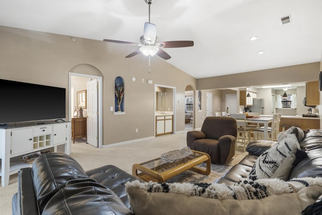 350 Wildwood Dr S Unit 31, Branson, MO 65616 - living room with arched walkways, light carpet, a ceiling fan, and lofted ceiling