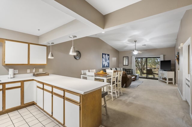 350 Wildwood Dr S Unit 31, Branson, MO 65616 - kitchen with a peninsula, open floor plan, light countertops, lofted ceiling, and pendant lighting