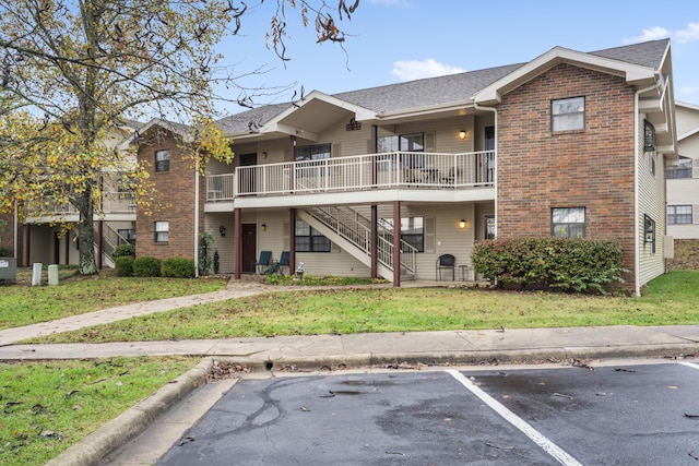 350 Wildwood Dr S Unit 31, Branson, MO 65616 - view of building exterior featuring stairs and uncovered parking
