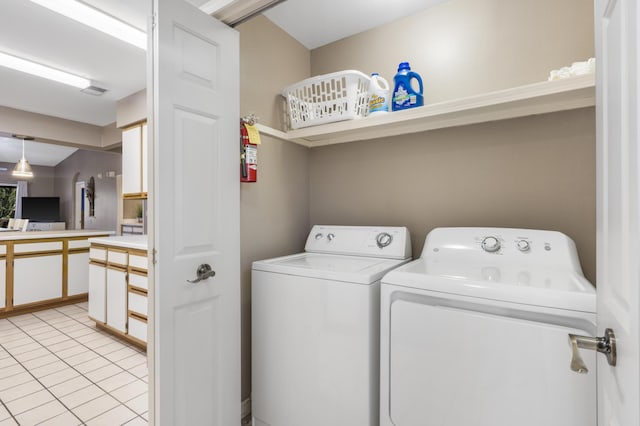 350 Wildwood Dr S Unit 31, Branson, MO 65616 - washroom featuring washing machine and dryer and light tile patterned floors