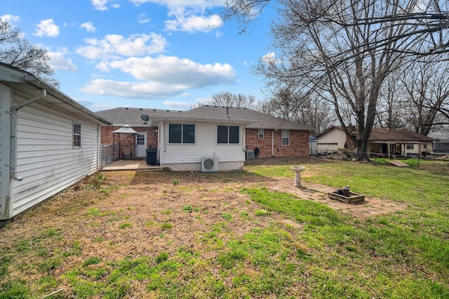 105 W Oak St, Nixa, MO 65714 - rear view of house featuring brick siding and a patio