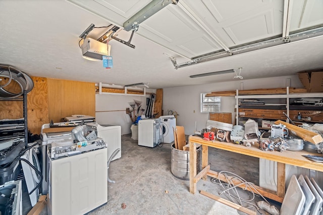 105 W Oak St, Nixa, MO 65714 - garage with a garage door opener, washer and clothes dryer, a workshop area, and wood walls