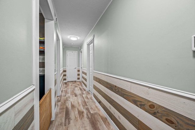 105 W Oak St, Nixa, MO 65714 - corridor with wood finished floors, wainscoting, and attic access