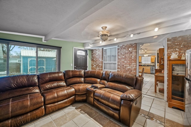 105 W Oak St, Nixa, MO 65714 - living room with ceiling fan, a textured ceiling, beamed ceiling, and light tile patterned floors
