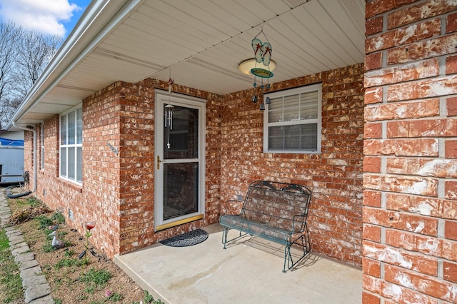 105 W Oak St, Nixa, MO 65714 - view of exterior entry featuring brick siding