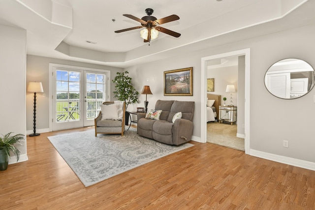 180 Grace Chapel Rd Unit 220, Blue Eye, MO 65611 - living area with a ceiling fan, light wood-style flooring, and a raised ceiling