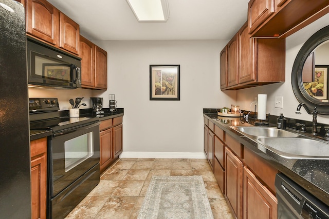 180 Grace Chapel Rd Unit 220, Blue Eye, MO 65611 - kitchen featuring black appliances, dark countertops, light stone finish floors, and brown cabinetry