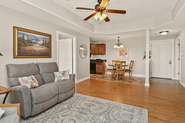 180 Grace Chapel Rd Unit 220, Blue Eye, MO 65611 - living area with light wood-style flooring, a ceiling fan, and a raised ceiling