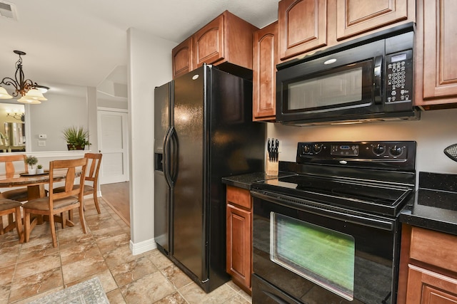 180 Grace Chapel Rd Unit 220, Blue Eye, MO 65611 - kitchen featuring black appliances, a chandelier, light stone finish floors, brown cabinetry, and decorative light fixtures