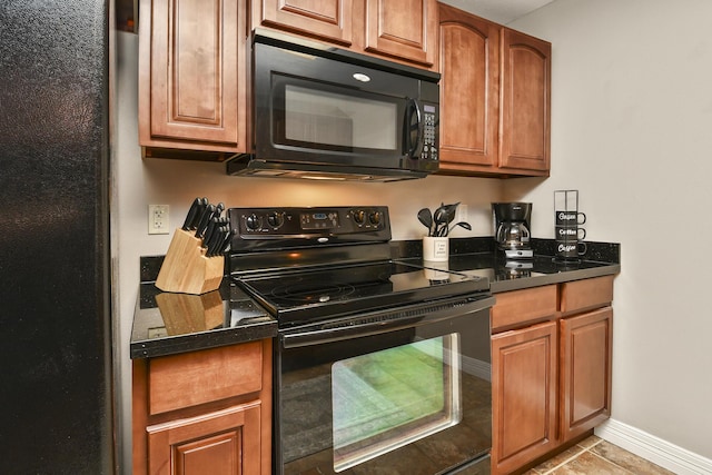 180 Grace Chapel Rd Unit 220, Blue Eye, MO 65611 - kitchen with black appliances, brown cabinets, and light tile patterned floors